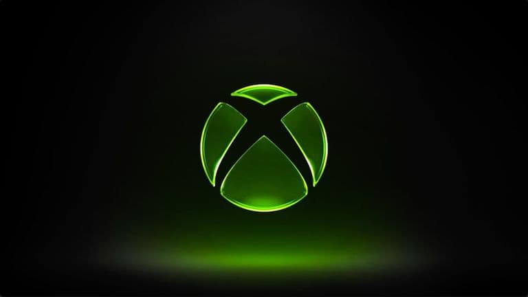 Groen oplichtend Xbox-logo tegen een donkere achtergrond