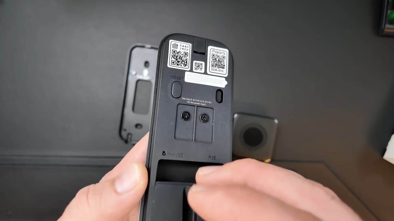 Rear view of the Aqara G400 doorbell showing the PoE network port and power screw terminals